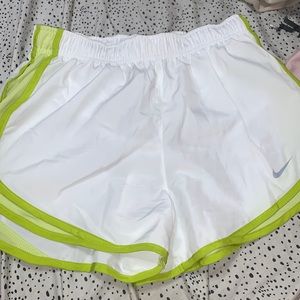 white and green nike shorts, size small